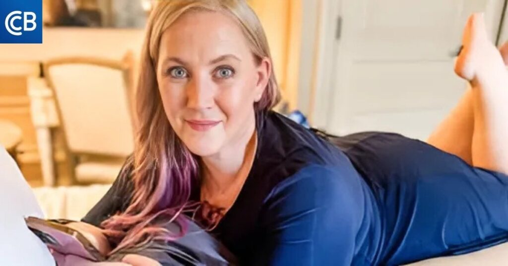 a person with purple hair laying on a bed