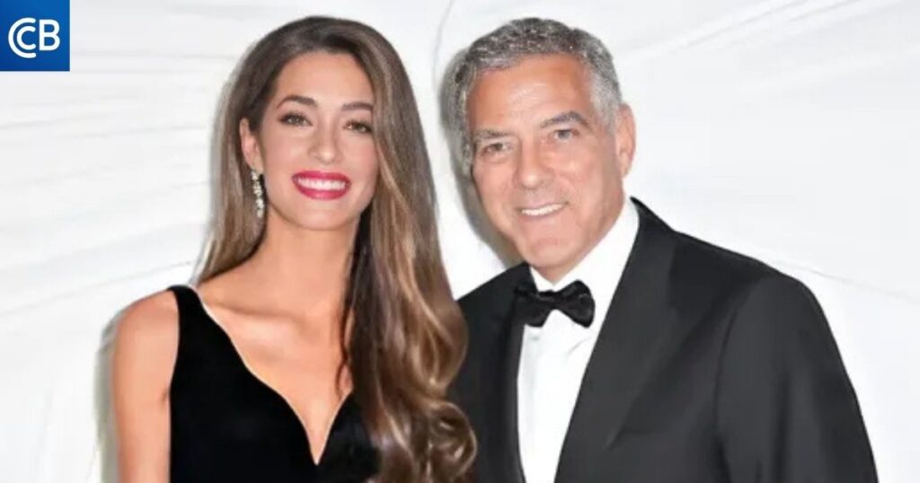 George Clooney and his wife Amal are posing for a photo