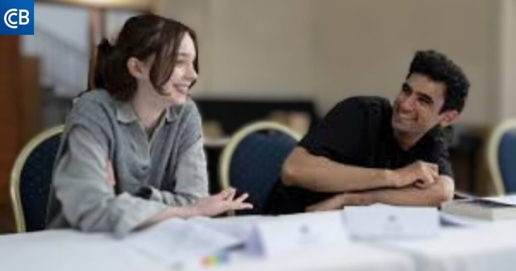 a group of people sitting at a table with papers