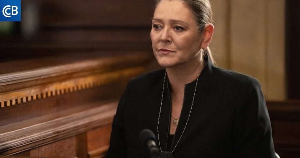 a person sitting at a table in a courtroom